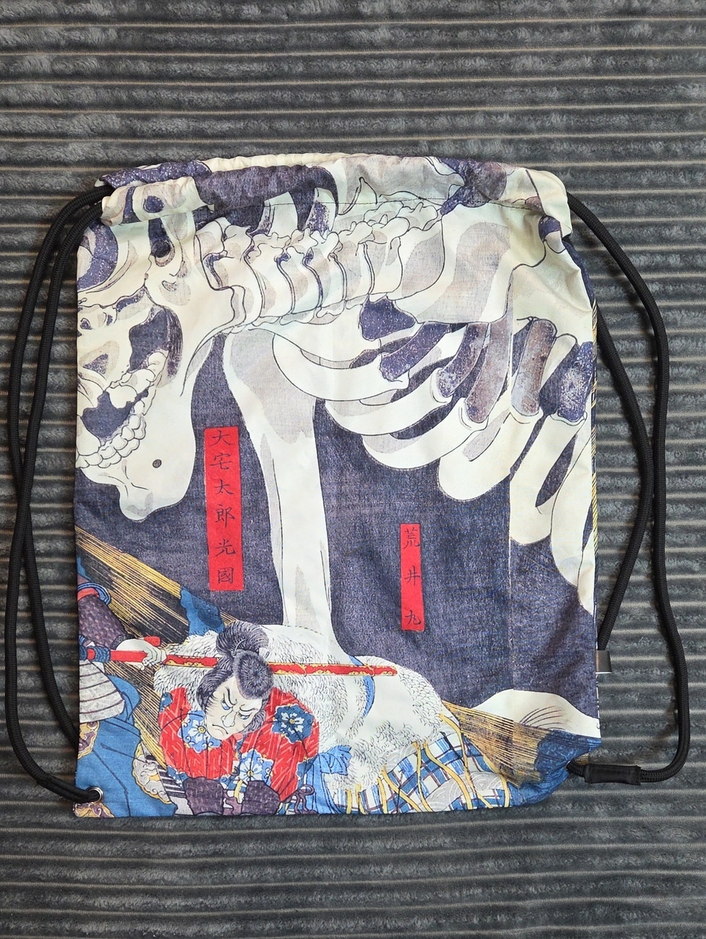 Skeleton Graphic Drawstring Backpack in Blue and White